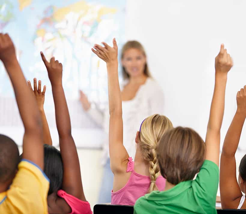 children raising hands